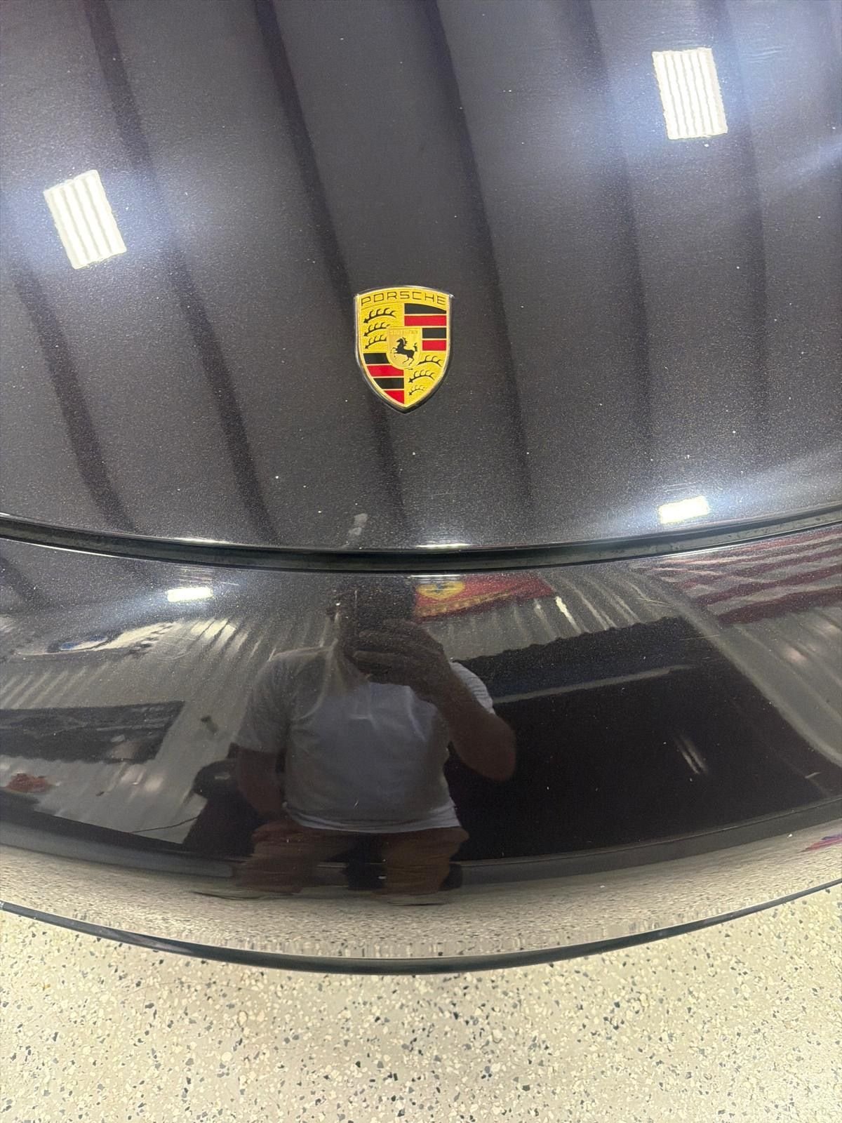 Detailed Porsche hood showing a mirror-like finish